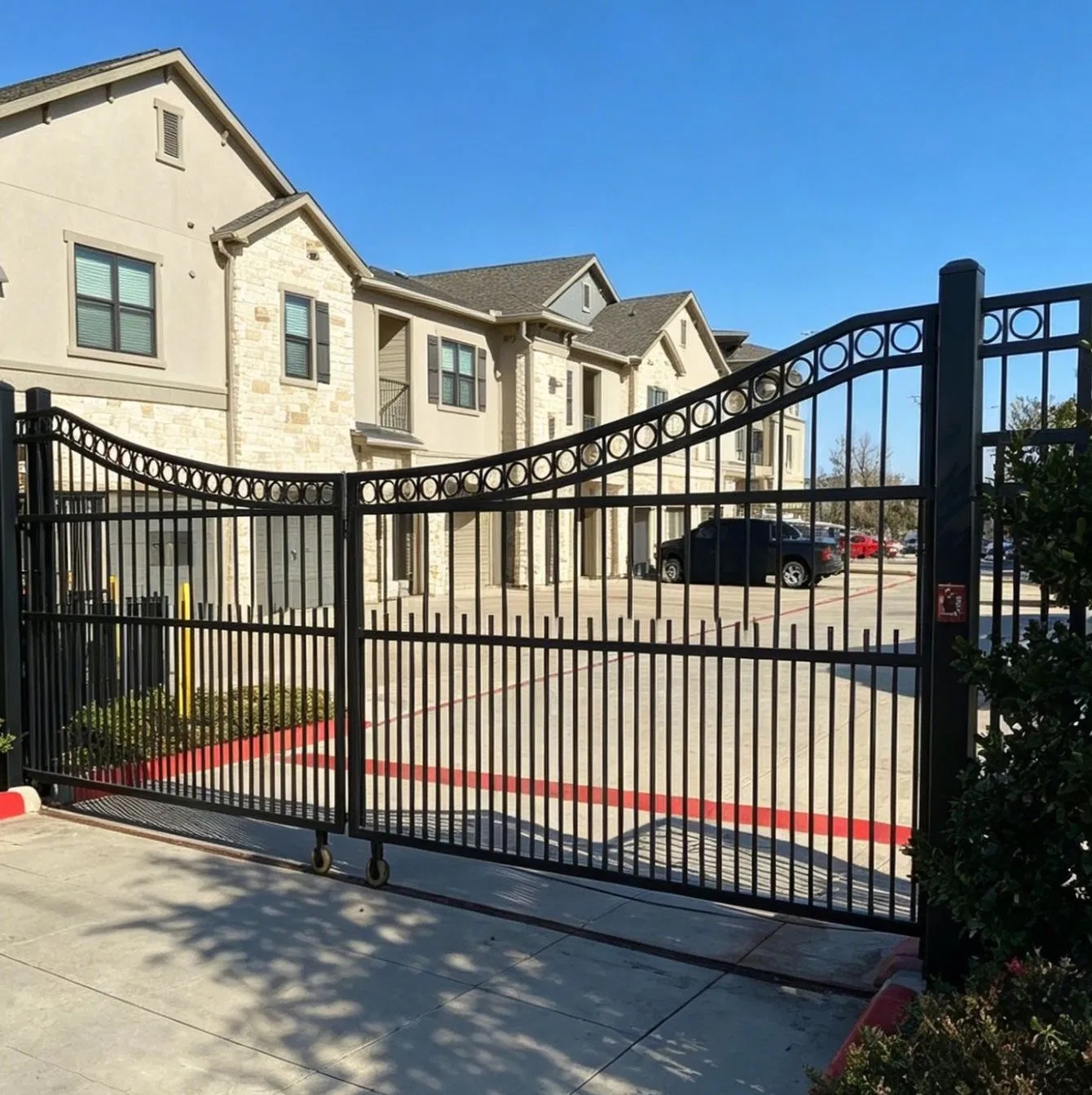 Iron swing gates at a community entrance